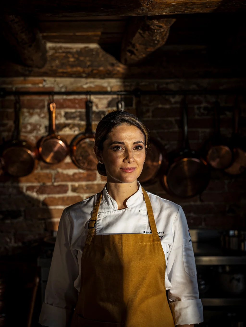Executive Chef Elena Rossi preparing fresh produce in the kitchen